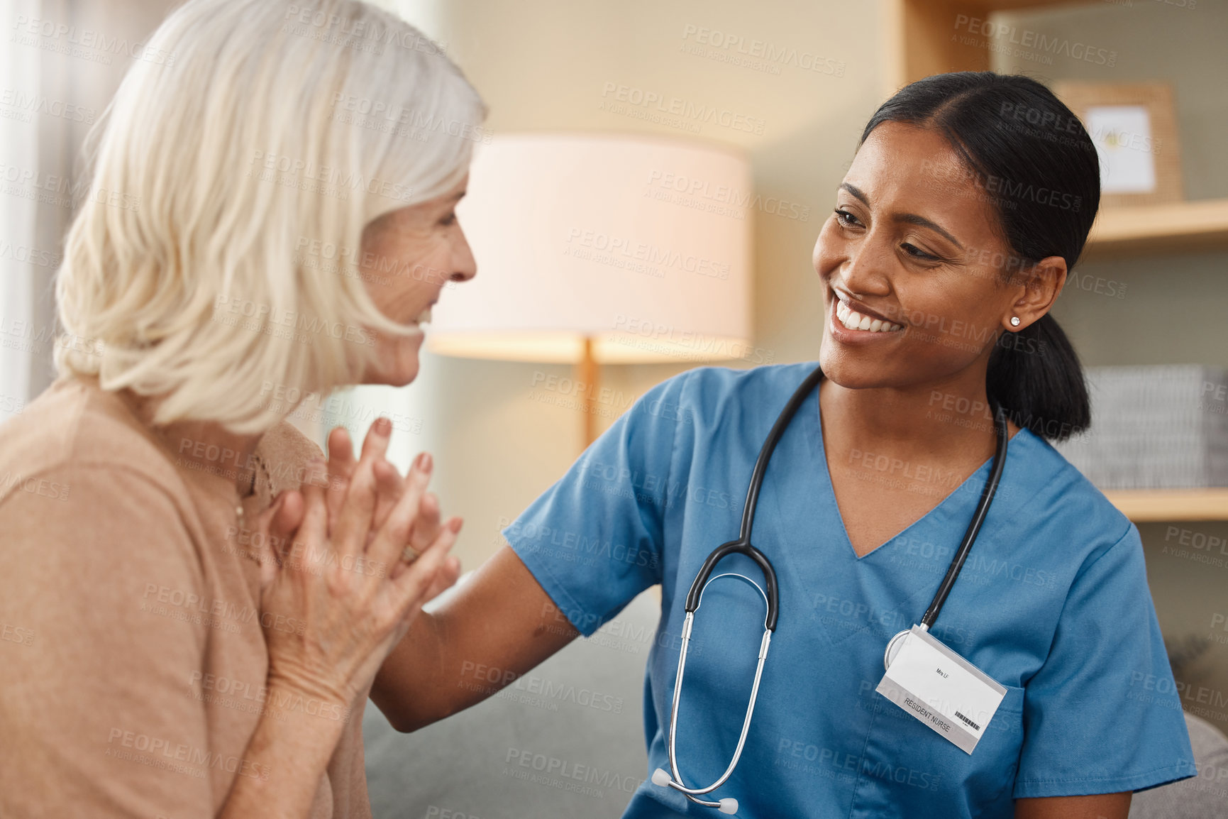 Buy stock photo Happy, healthcare or medical with old woman and nurse on sofa in retirement home together. Assisted living, conversation and smile with senior patient talking to medicine professional in apartment