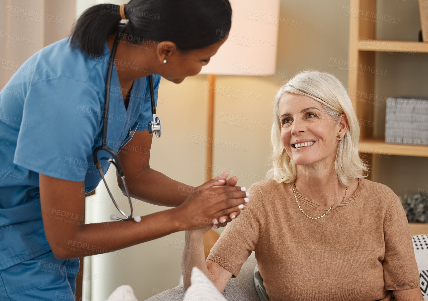 Buy stock photo Shot of a doctor having a consultation with a senior woman at home