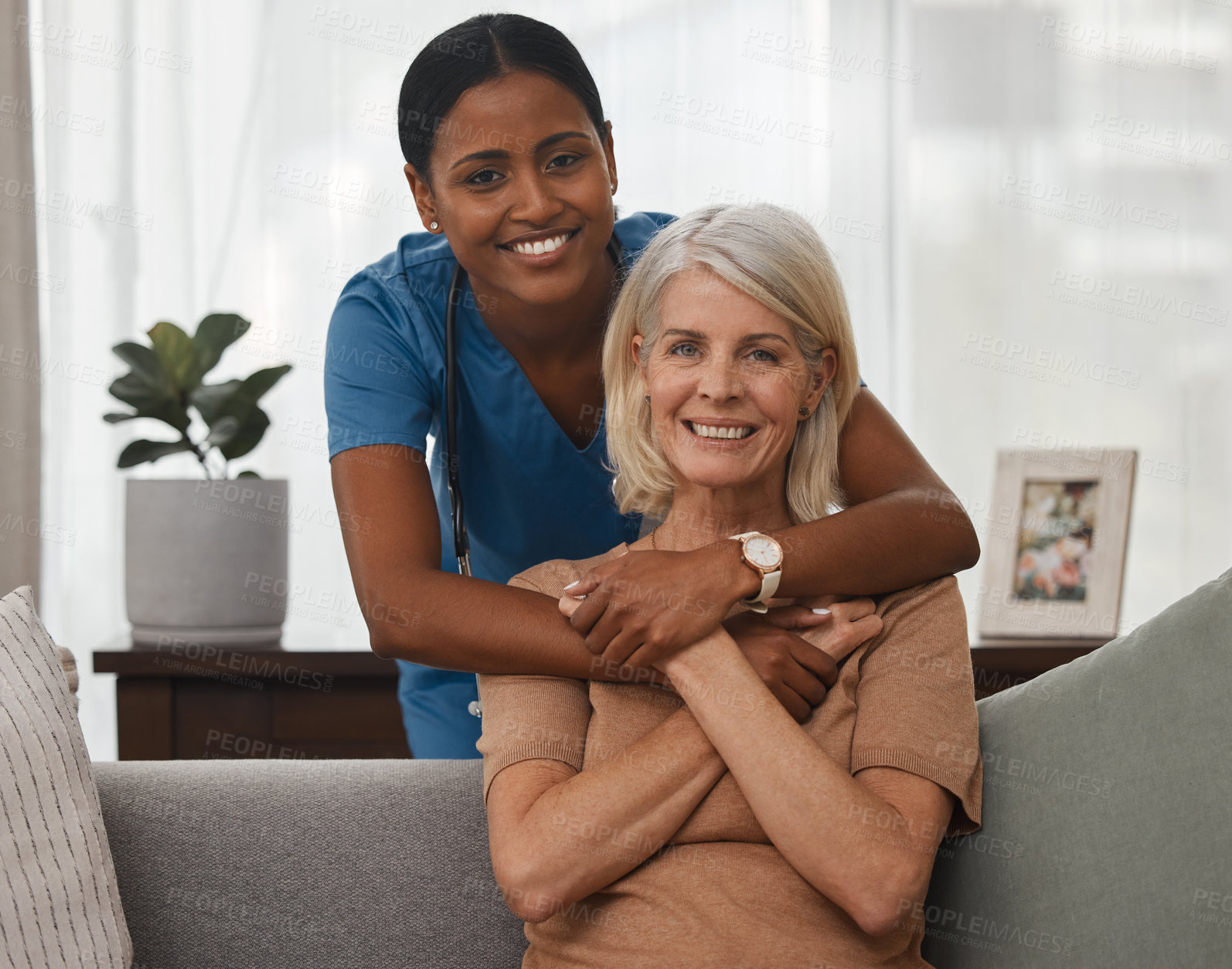 Buy stock photo Shot of a doctor caring for a senior woman at home