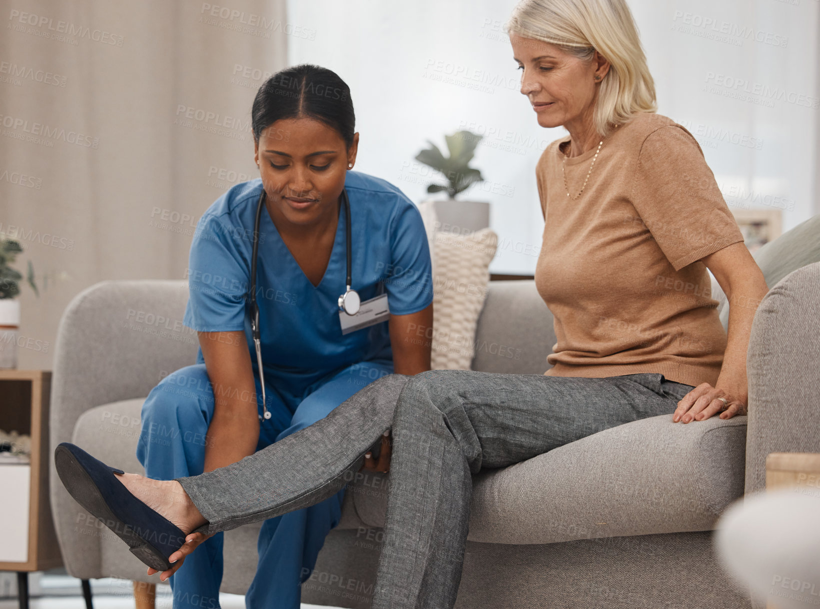 Buy stock photo Foot, nurse or senior woman with physical therapy for injury, rehabilitation massage and healthcare worker help with pain. Elderly patient, doctor and physio therapist or medical expert on sofa