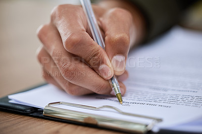 Buy stock photo Closeup shot of an unrecognisable man going through paperwork