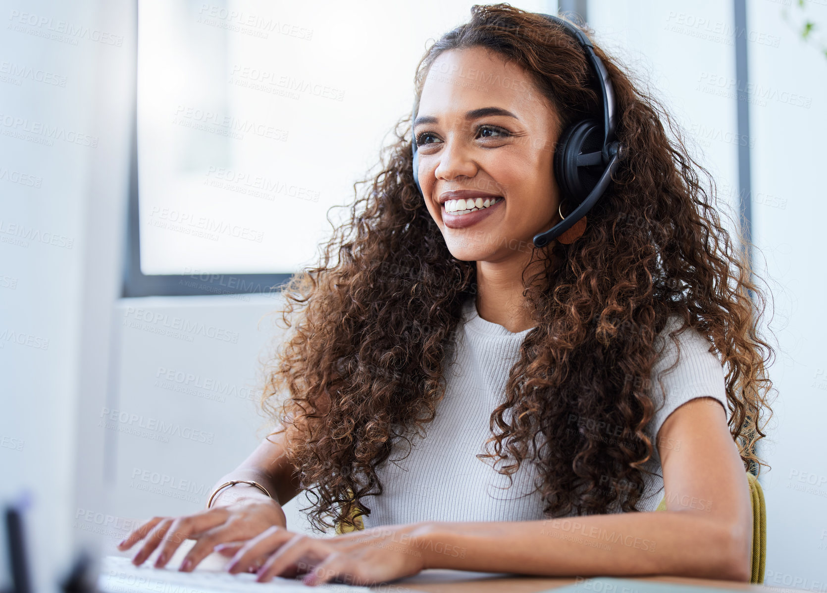 Buy stock photo Shot of a young businesswoman working in a call center