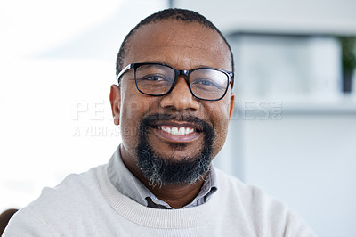 Buy stock photo Shot of a male businessman in his office