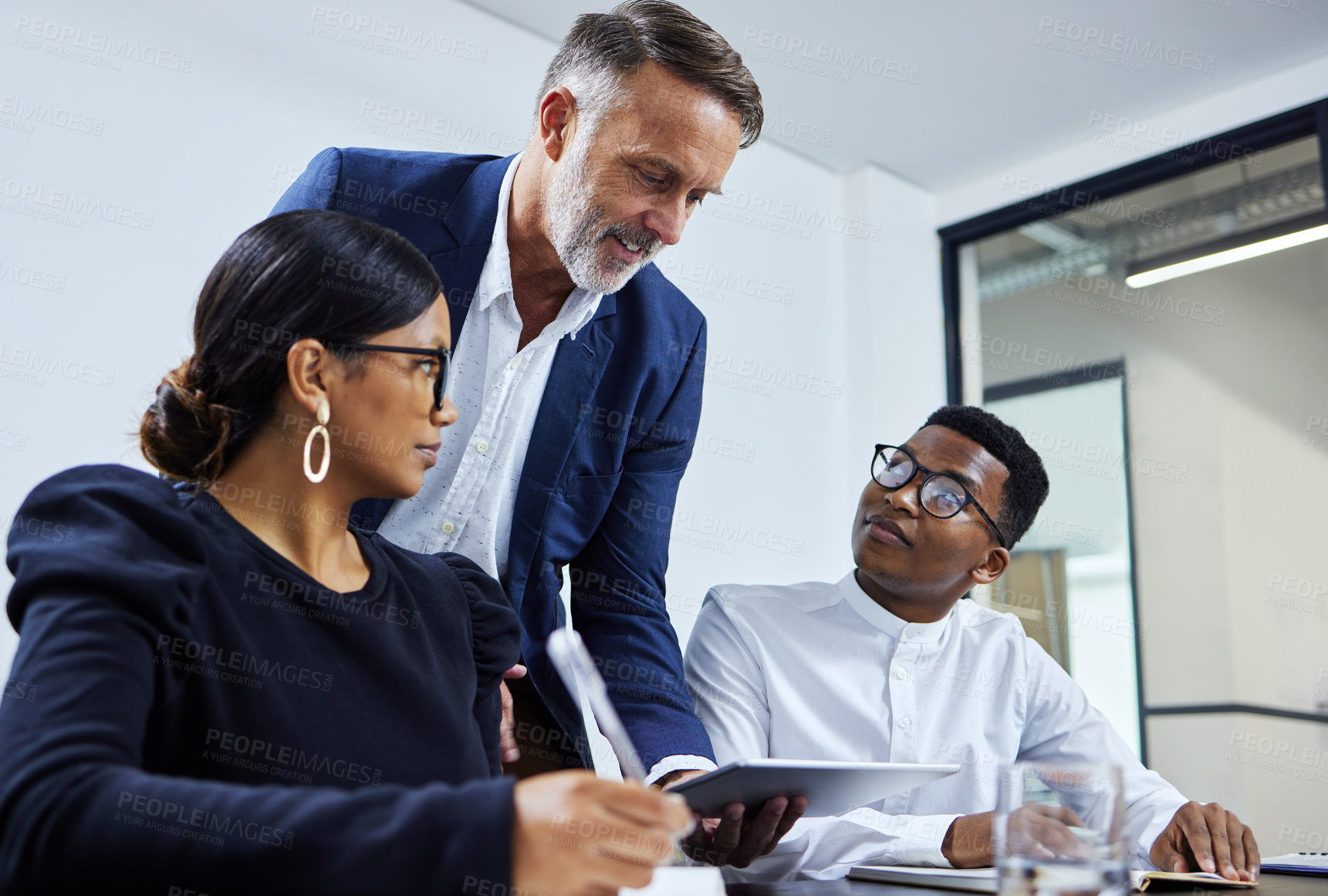 Buy stock photo Business people, meeting and mentor with tablet in office for teamwork, feedback or planning project together. Coaching, diversity and employees for collaboration, review proposal or development team