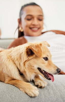 Buy stock photo Shot of a beautiful young woman relaxing on the couch with her dog at home