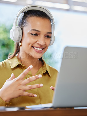 Buy stock photo Cropped shot of an attractive young businesswoman using her laptop to have an online meeting at home