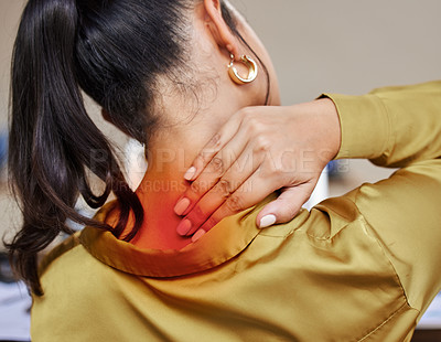 Buy stock photo Rearview shot of an unrecognizable businesswoman rubbing her neck in pain while working from home