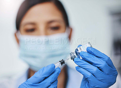 Buy stock photo Shot of a young female researcher working in a laboratory