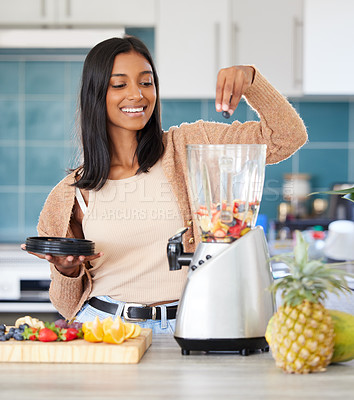 Buy stock photo Indian woman, fruit and blender for drink in kitchen, nutrition and protein shake for detox in home. Female person, electric machine and mix organic ingredients for vegan diet, smoothie and minerals