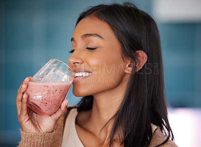 Buy stock photo Indian woman, smile and drinking smoothie for health, nutrition and juice for detox in home. Female person, drink and organic ingredients for vegan diet, vitamins and minerals in protein shake
