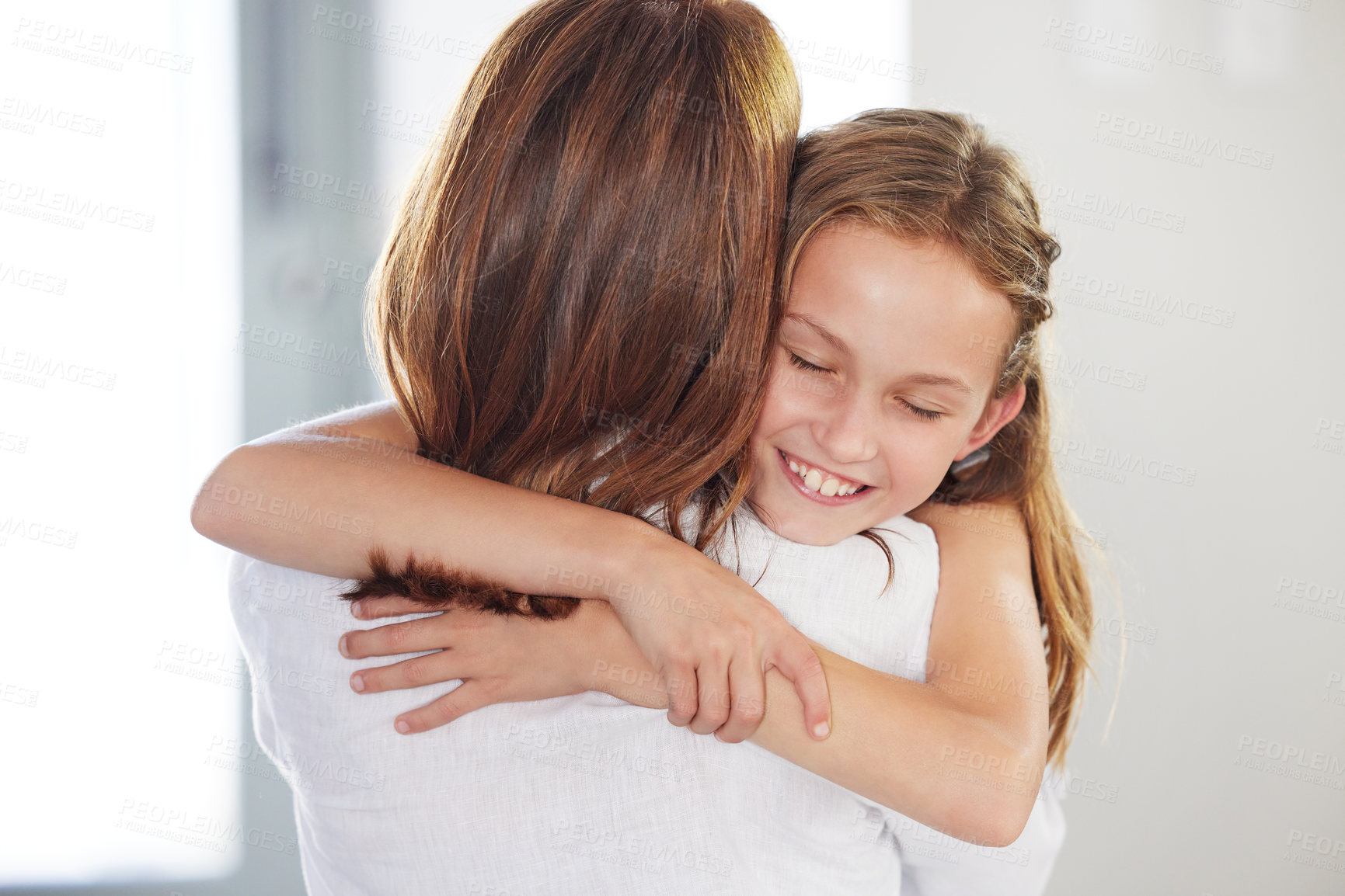 Buy stock photo Home, smile and mother hug child for love, care and family bonding together in house. Face, happy kid and embrace mom for support, connection and trust in healthy relationship of girl with parent