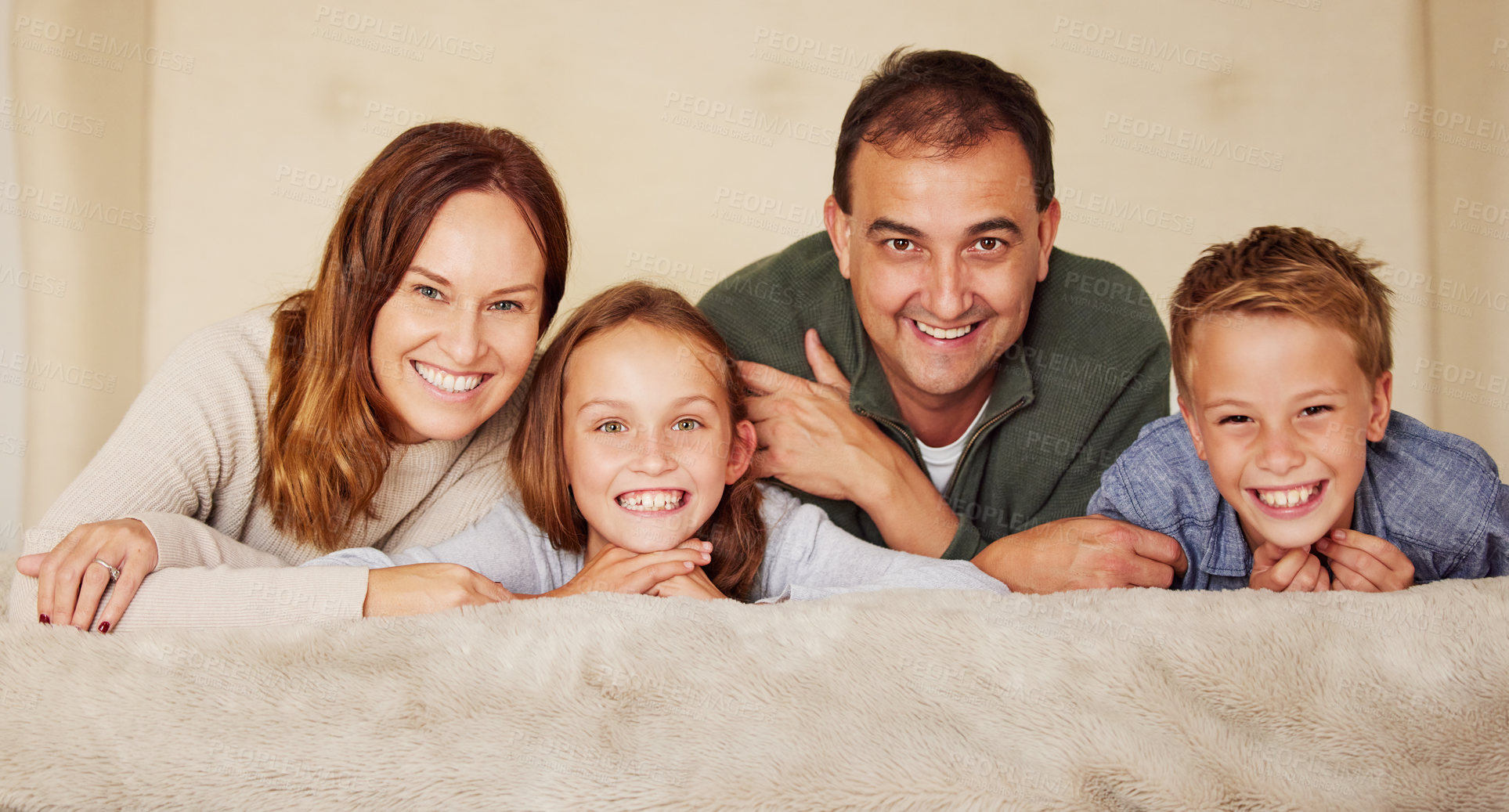 Buy stock photo Happy family, parents and children in portrait on bed for love, peace and relax at home in bedroom. Connection, smile and people in house or apartment for mother, father and kids together in Spain