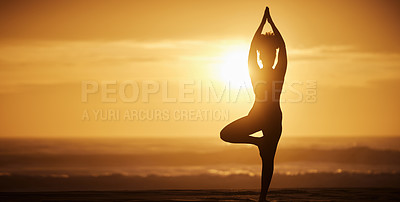 Buy stock photo Shot of a unrecognizable female doing yoga on the beach