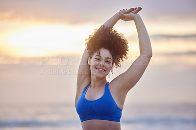 Buy stock photo Shot of a young female doing yoga on the beach