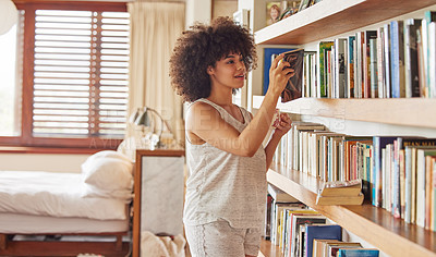 Buy stock photo Girl, bookshelf and choice for reading in home, bedroom and morning to relax with thinking on vacation. Woman, person and happy with books, search or decision for story, novel or poetry in apartment