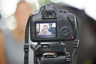 Buy stock photo Shot of a young woman using a camera to record for her vlog in a gym