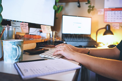 Buy stock photo Cropped shot of an unrecognizable woman sitting alone and using her computer to work from home