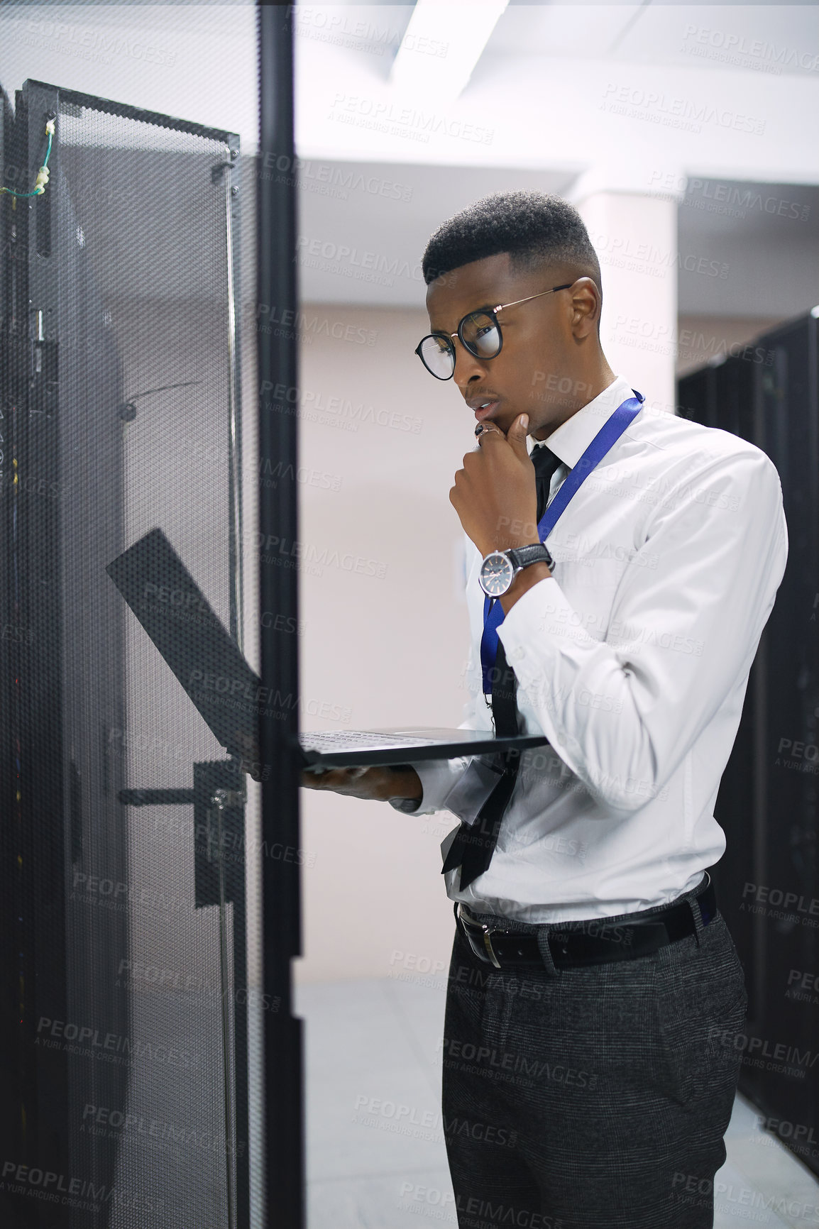 Buy stock photo Man, engineer and thinking with laptop in server room for software, hardware or network repair. Male person, IT technician or wonder with computer for technical problem solving, fix or system backup