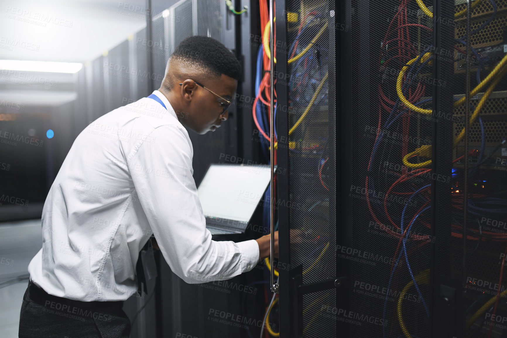 Buy stock photo Man, technician and server room with laptop screen for network repair or hardware fault at data center. Male person, IT engineer or computer for technical issue, internet service or system backup