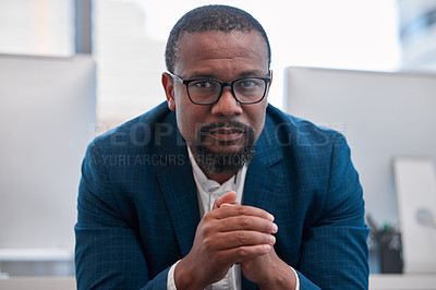 Buy stock photo Shot of a young man sitting in a modern office
