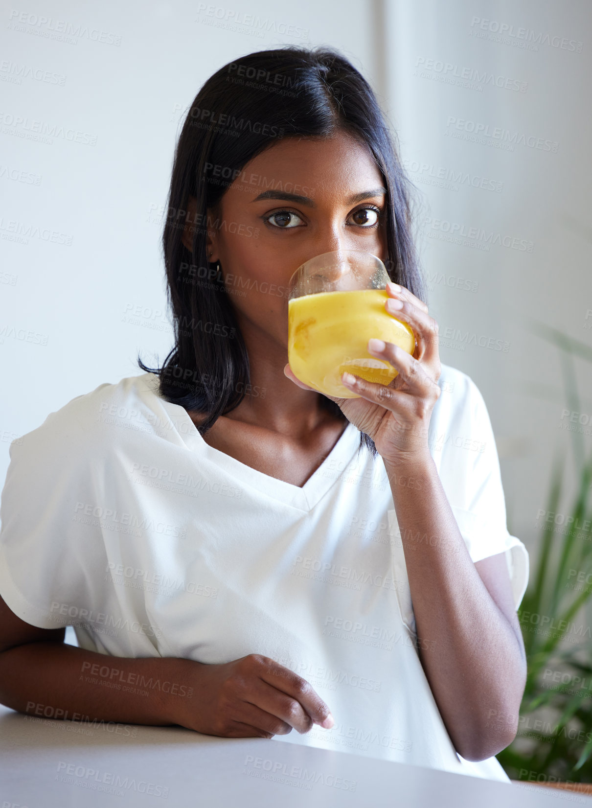 Buy stock photo Portrait, home and Indian woman with juice, drink and nutrition to enjoy, healthy and apartment of girl. House, person and model with glass of natural liquid, morning and beverage for vitamin c