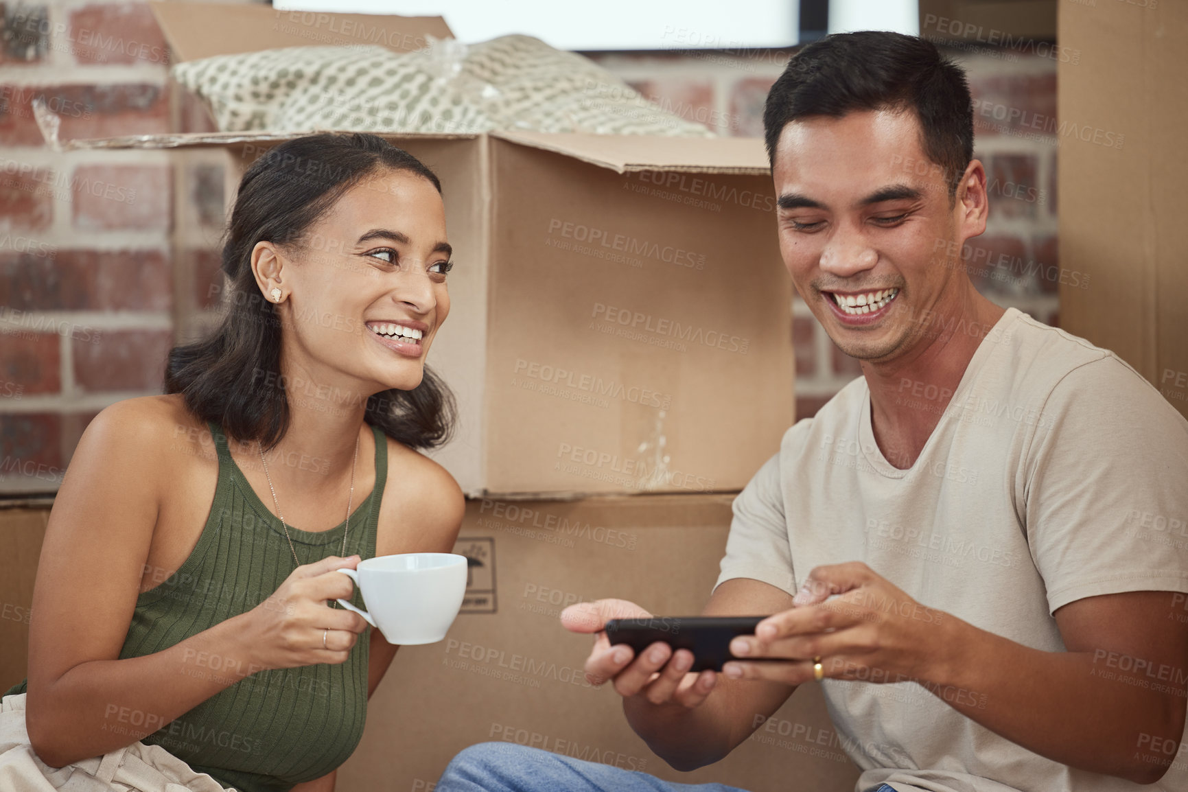 Buy stock photo Couple, smartphone and boxes in new house and happy, relax and browse in real estate for mortgage and property investment. Blog, internet and social media or content, smile and online post together