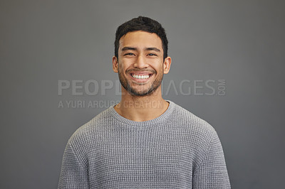 Buy stock photo Portrait of man in studio with smile, happy mindset on studio backdrop in Indonesia and casual fashion. Relax, confidence and natural face of calm Asian male model on grey background with happiness.