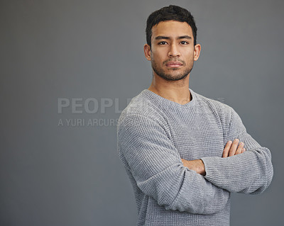 Buy stock photo Portrait of man with mockup, arms crossed and serious on studio backdrop in confident casual fashion promo. Relax, confidence and face of male on grey background with focus, pride and mock up space.