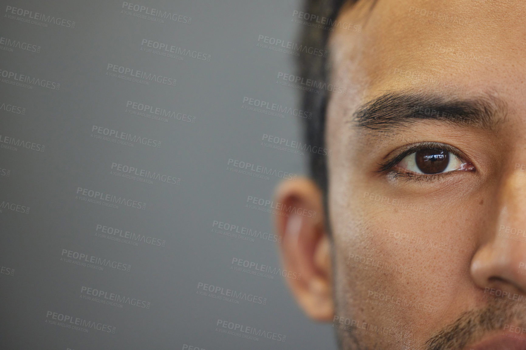 Buy stock photo Mockup, portrait and half eyes of a man isolated on a grey background in studio. Serious, Asian and closeup face of a person with space for expression, looking handsome and a young eye on a backdrop