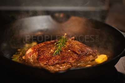 Buy stock photo Shot of a piece of steak bring cooked