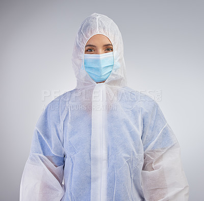 Buy stock photo Ppe, nurse and hazmat suit in portrait with mask on for safety and medical practice in white studio background. Danger, healthcare worker or female person in scrubs for viral defence and protection