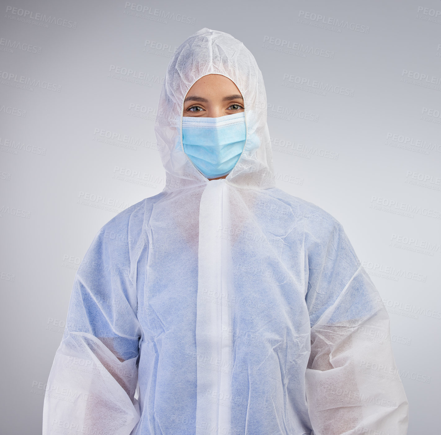 Buy stock photo Ppe, nurse and hazmat suit in portrait with mask on for safety and medical practice in white studio background. Danger, healthcare worker or female person in scrubs for viral defence and protection