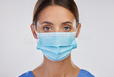 Buy stock photo Shot of a young female nurse against a studio background