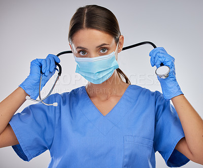 Buy stock photo Mask, doctor and woman with stethoscope, studio and safety with gloves and PPE for healthcare. White background, medical and person with help, portrait  and healthy in clinic and hands in hospital