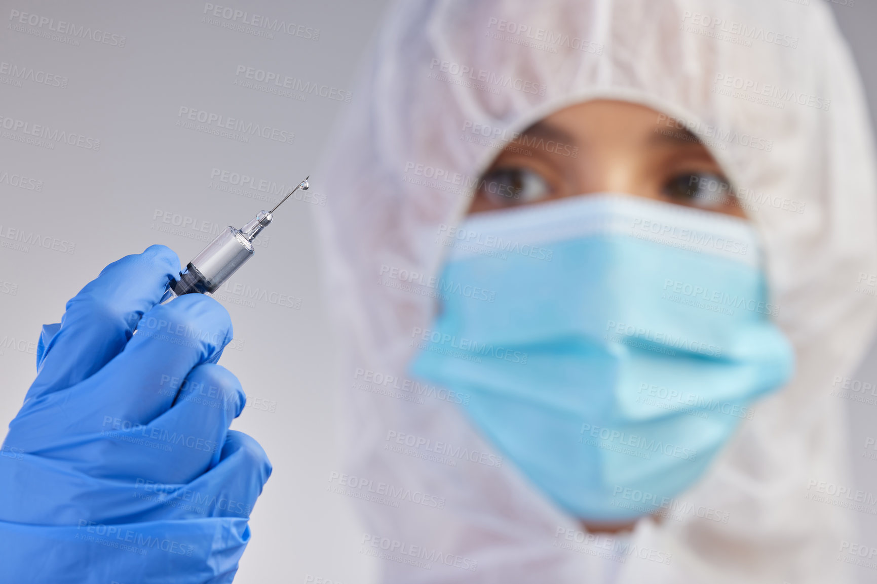 Buy stock photo Ppe, nurse and needle in white studio background for vaccination, hospital safety and medical practice. Danger, healthcare worker or female person in scrubs for viral defence, wellness and protection