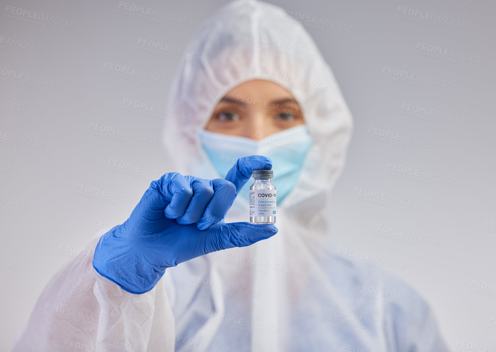 Buy stock photo Portrait, vial and nurse in ppe with mask on for safety and medical practice in white studio background. Danger, healthcare worker or female person in scrubs for viral defence and protection