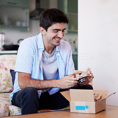 Buy stock photo Shot of a young man taking a photo with his camera