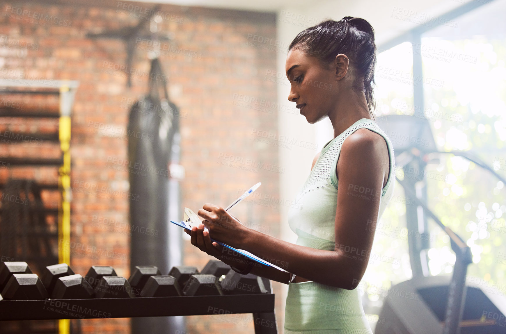 Buy stock photo Exercise, personal trainer and woman in a gym, inventory and checklist for equipment, schedule and hygiene inspection. Female person, entrepreneur or athlete with documents, feedback and training