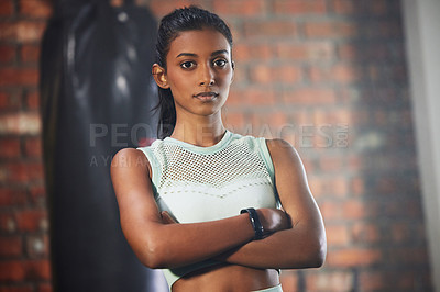 Buy stock photo Woman, fitness and serious face in portrait with athlete in gym, arms crossed and determination with confidence. Mockup space, female person in exercise studio and active with health, sport and tough