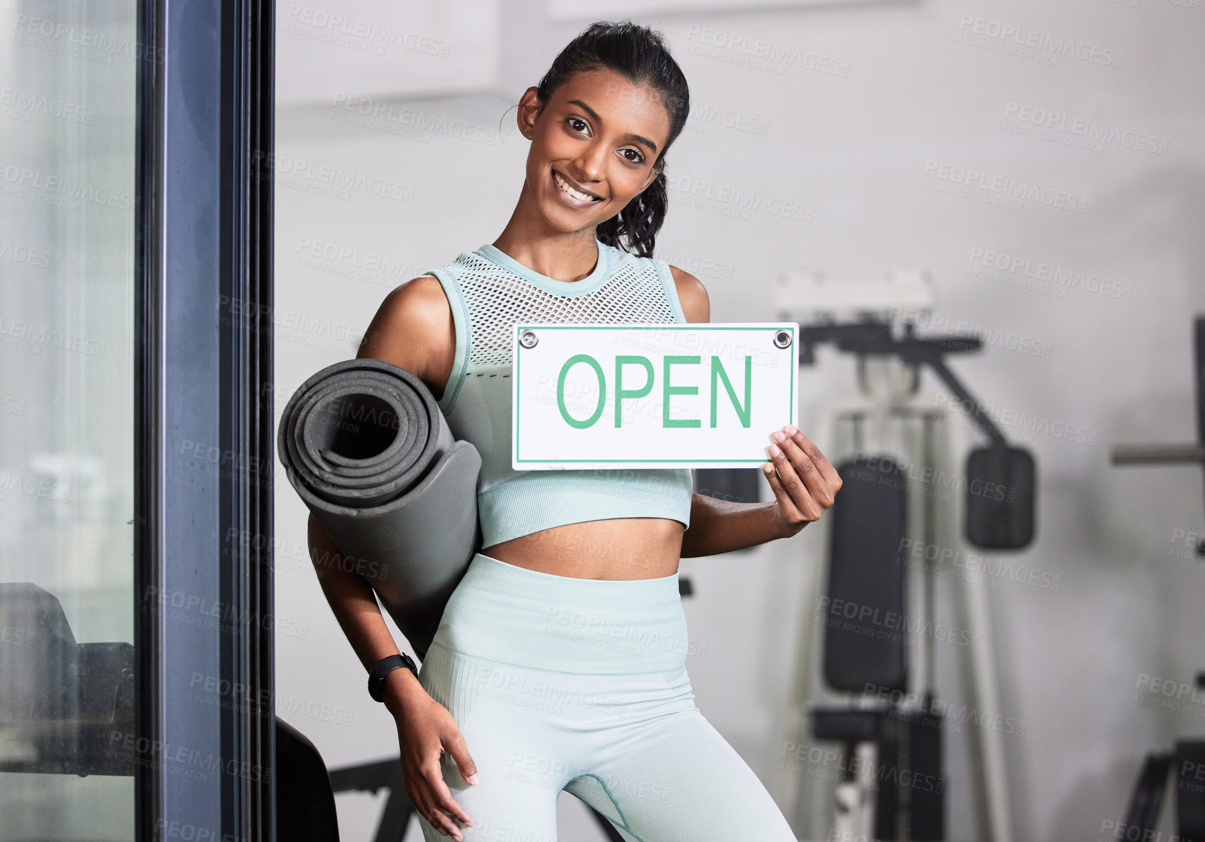 Buy stock photo Happy woman, portrait or personal trainer at gym with an open sign for workout exercises or training. Friendly manager, fitness business or healthy girl with a smile holding a board or welcome poster