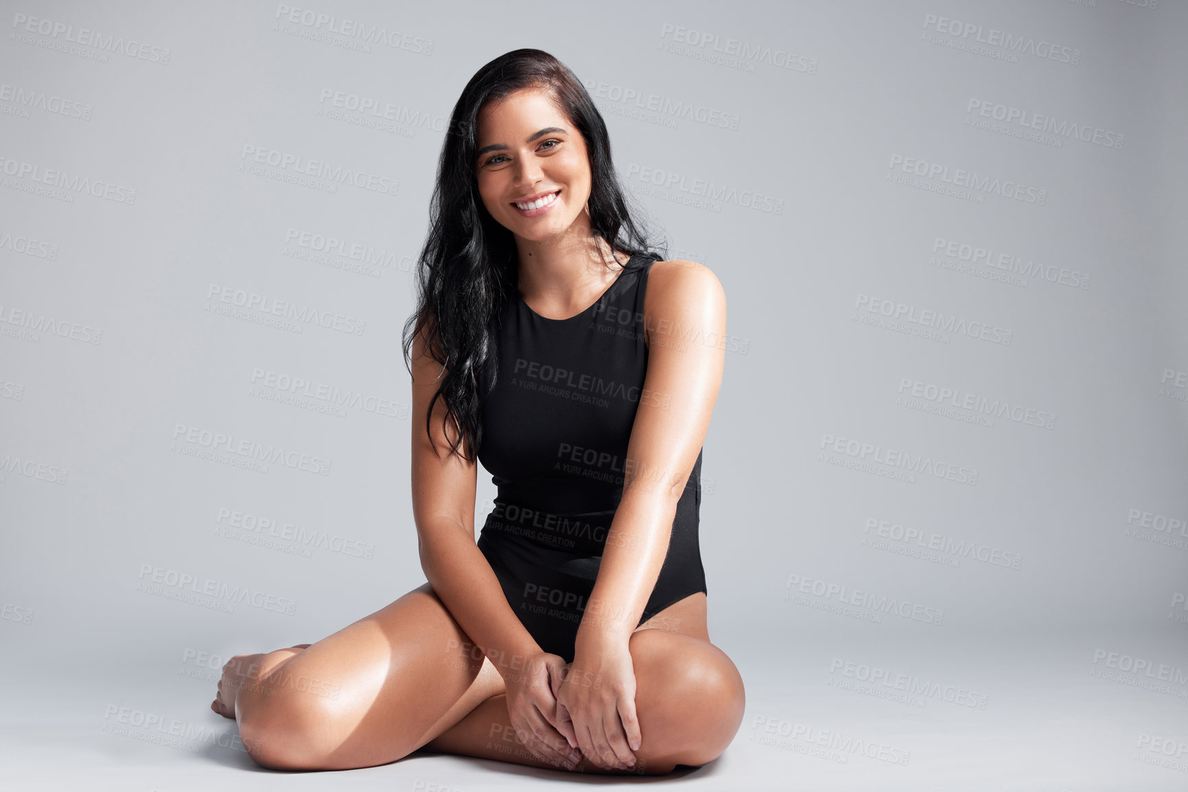 Buy stock photo Full length portrait of an attractive young woman posing in studio against a grey background