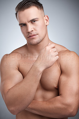 Buy stock photo Man, muscular and serious in studio for fitness, gym or workout for physical training or exercise. Model, smile and portrait for bodybuilder or confident with muscle growth or shirtless for wellness 