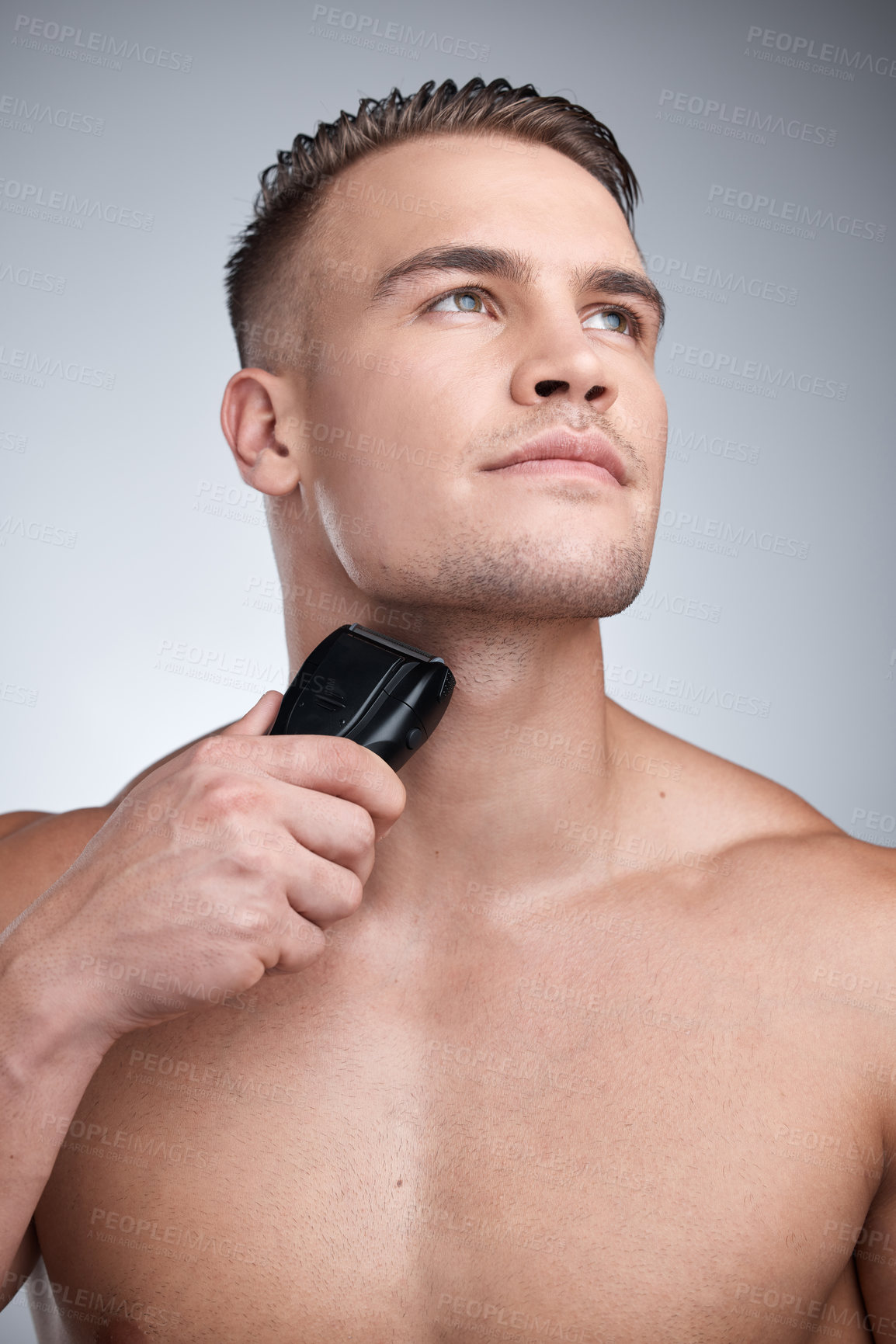 Buy stock photo Razor, shave and machine with man in studio, skincare and hygiene for facial grooming. Cosmetic, hair removal and wellness for dermatology, maintenance and electric cleaning tool on background