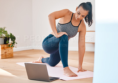 Buy stock photo Shot of a young woman practicing yoga at home