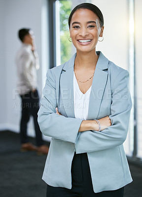 Buy stock photo Shot of a young businesswoman standing in a house with her arms crossed