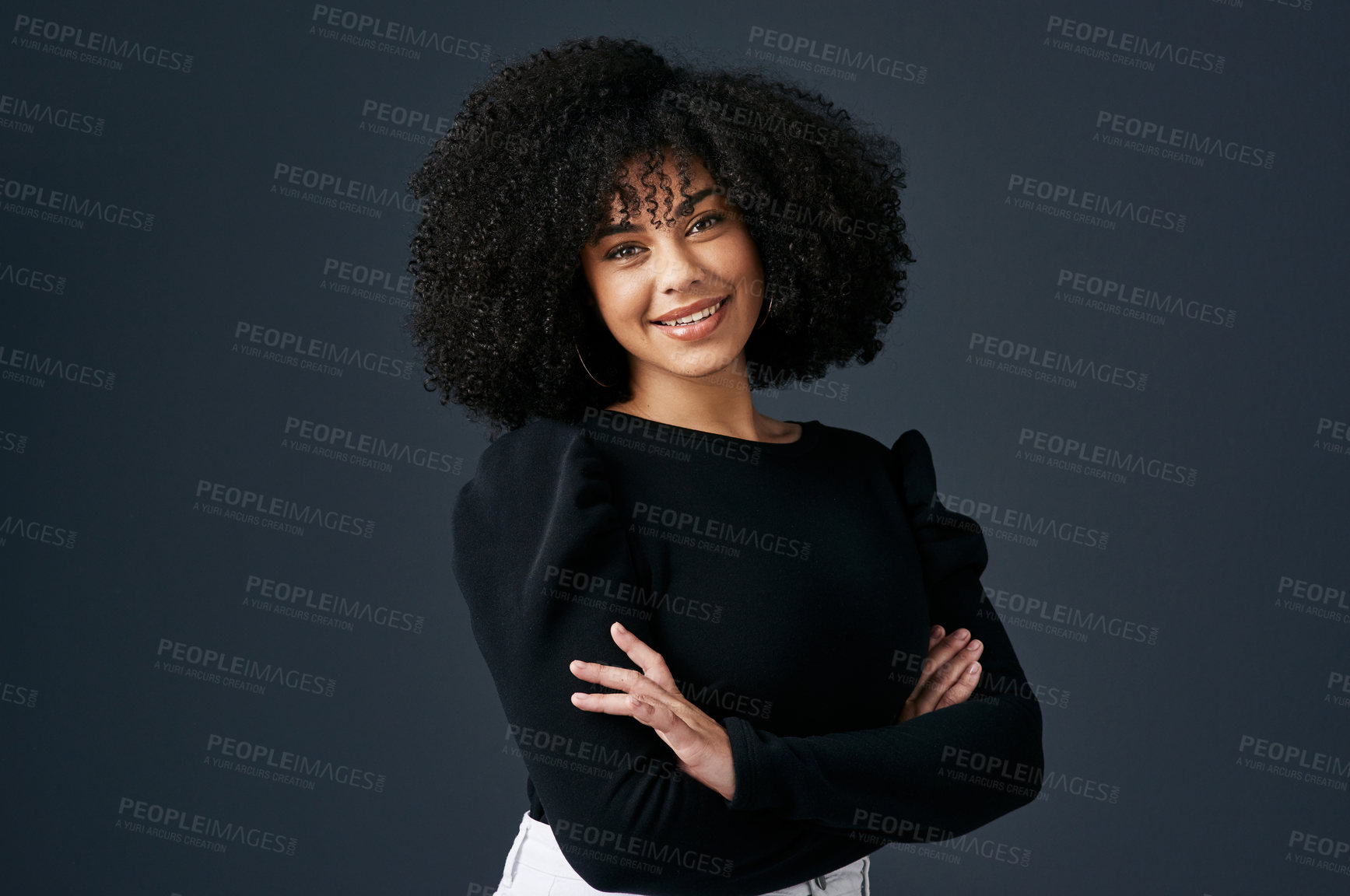 Buy stock photo Shot of a young businesswoman against a studio background