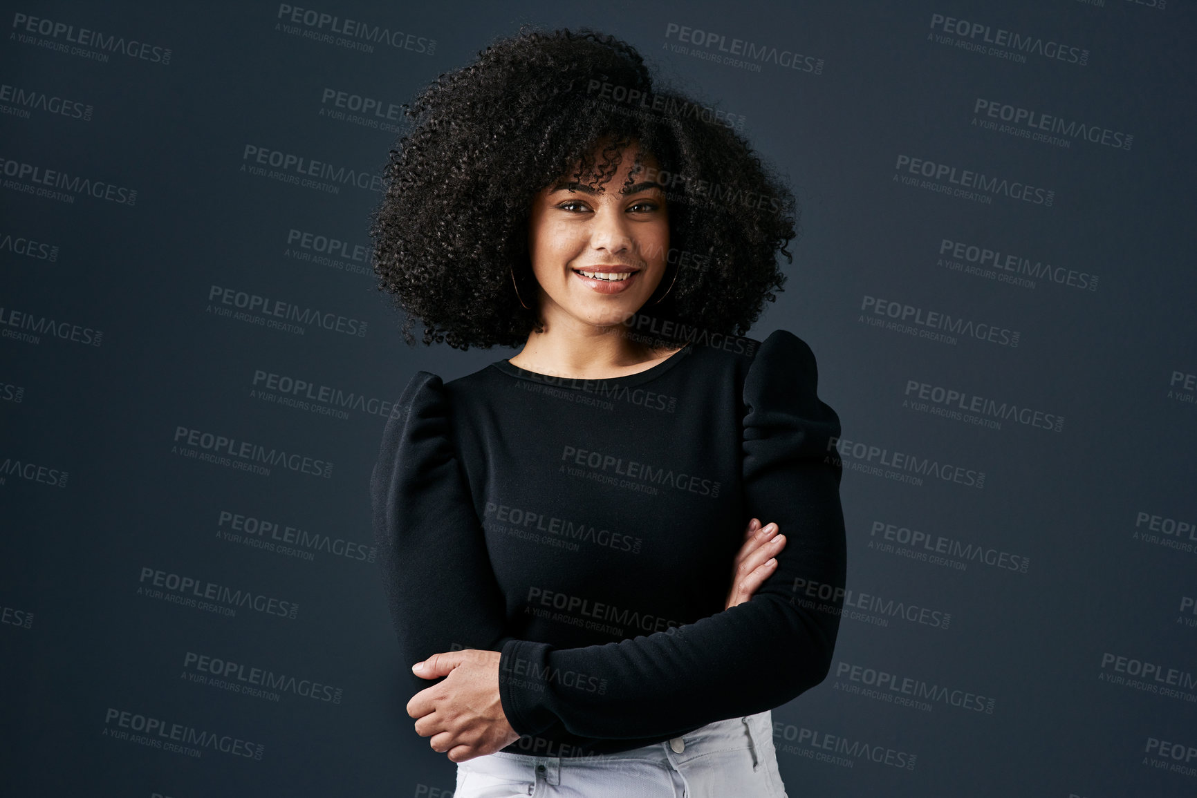 Buy stock photo Shot of a young businesswoman against a studio background