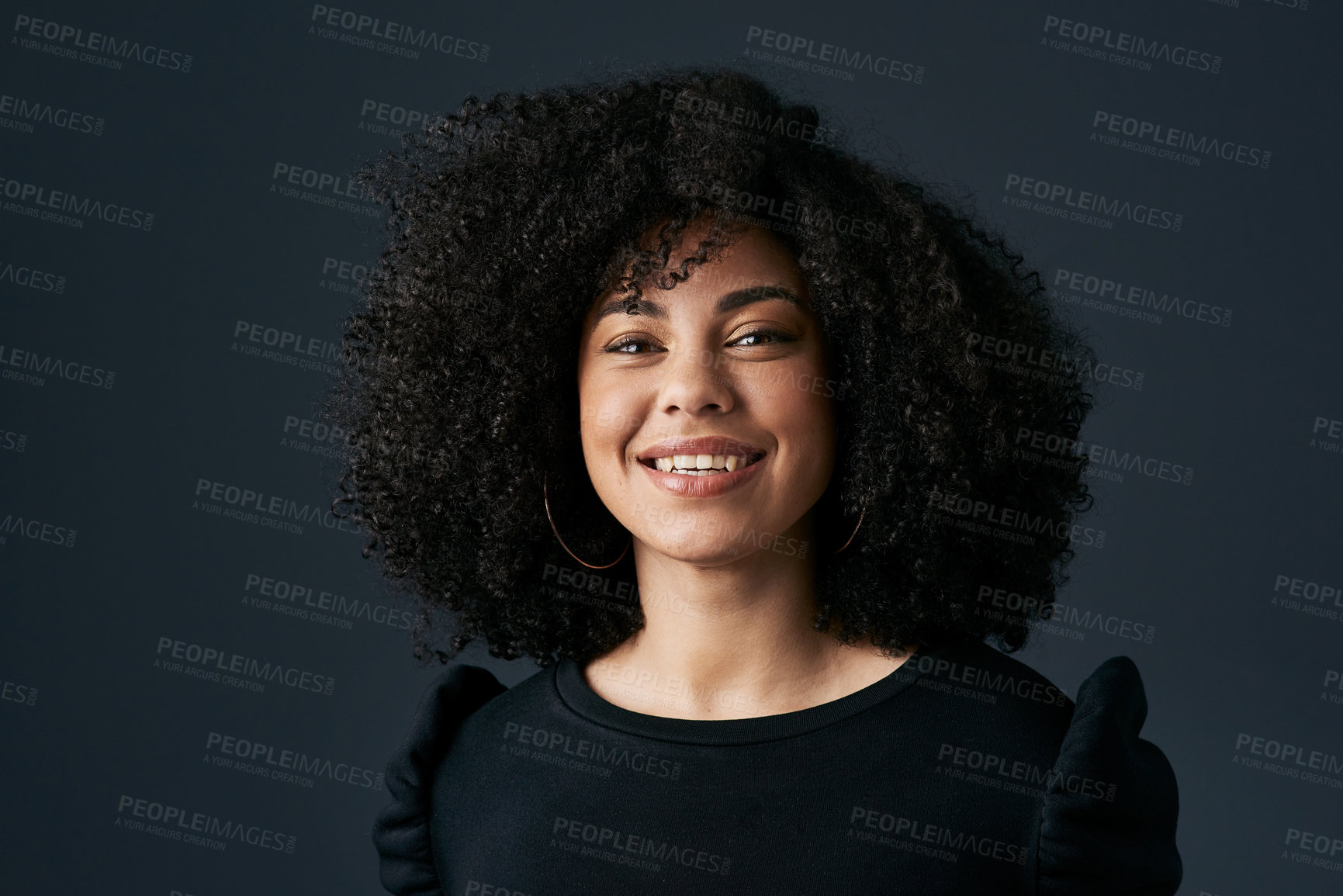 Buy stock photo Shot of a young businesswoman against a studio background