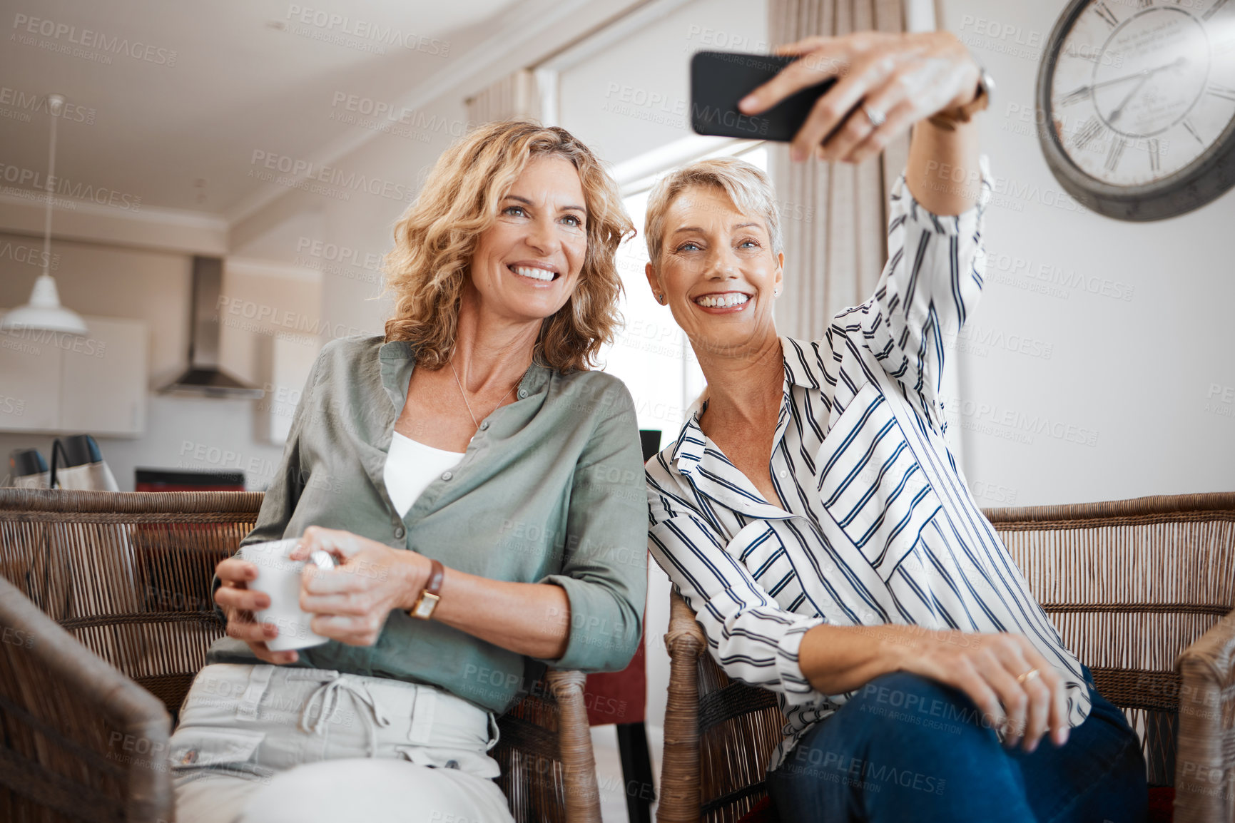 Buy stock photo Women, friends and happy with selfie in lounge, photography and together with mobile app in home. Mature people, bonding and relax in living room with memory, post or social media at apartment