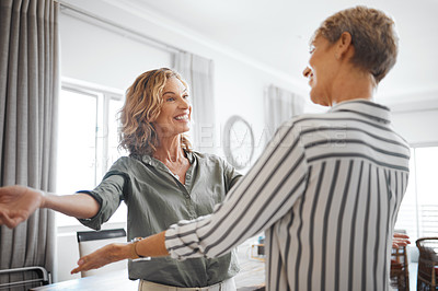 Buy stock photo Shot of two female friends hugging one another